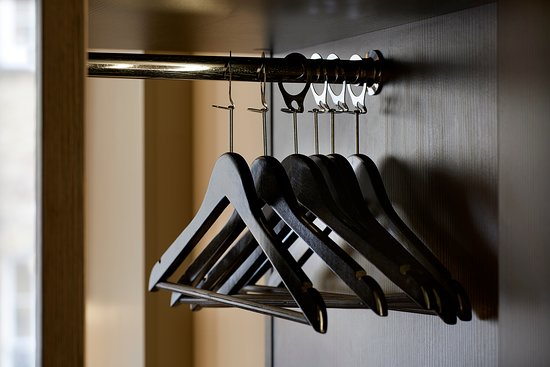 Durable hotel hangers for neat and organized closets.